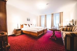 Postel nebo postele na pokoji v ubytování Cella Central Historic Boutique Hotel
