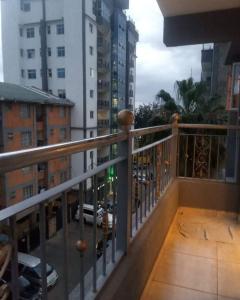 a balcony with a view of a city at Lux Suites Neema Court Furnished Apartments in Nairobi