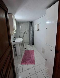 a small bathroom with a sink and a toilet at SUNDAY HOUSE in Skala Kallirakhis