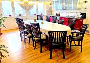 a dining room with a table and chairs at Dreamly Suites in Oslip