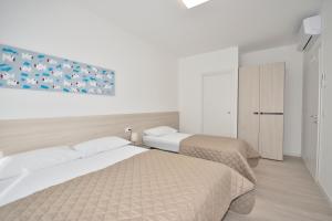 Ένα ή περισσότερα κρεβάτια σε δωμάτιο στο Condominio Aliante