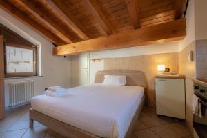 Posteľ alebo postele v izbe v ubytovaní Inn Aosta Apartments