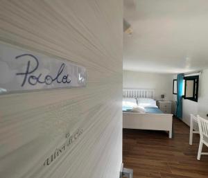 Postel nebo postele na pokoji v ubytování Ulivi di Cleo