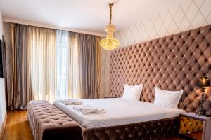Ένα ή περισσότερα κρεβάτια σε δωμάτιο στο Capital City Center Apart Residence