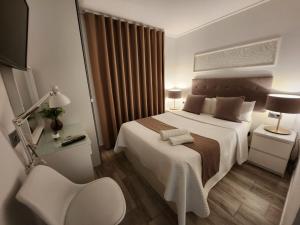 Postel nebo postele na pokoji v ubytování DON LEONE Hotel