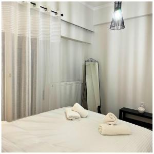Posteľ alebo postele v izbe v ubytovaní Memories Apartments Μονοκατοικία στο Καρπενήσι