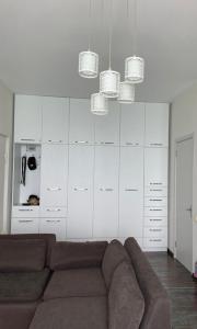 a living room with a couch and white cabinets at Beautiful sea view apartment in Gonio in Gonio
