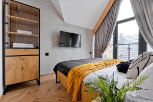 Postel nebo postele na pokoji v ubytování Domek Panorama z Jacuzzi