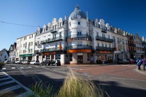 a large white building on the side of a street at Hotel de la Terrasse in Berck-sur-Mer