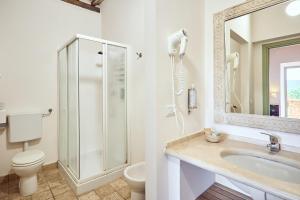 a bathroom with a shower and a toilet and a sink at Podere Lamberto in Montepulciano +29 photos