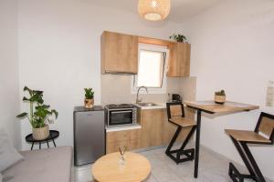 Kuchyň nebo kuchyňský kout v ubytování Jasmine Suites "By Checkin"