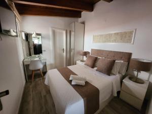 Postel nebo postele na pokoji v ubytování DON LEONE Hotel