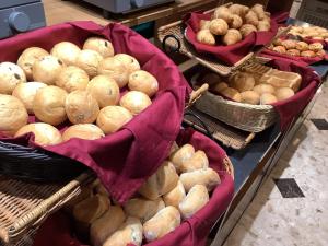a bunch of baskets filled with lots of potatoes at APA Hotel & Resort Nishishinjuku-Gochome-Eki Tower in Tokyo