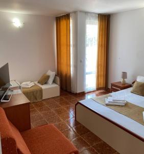 TV a/nebo společenská místnost v ubytování Къща за гости CANAVAN'S