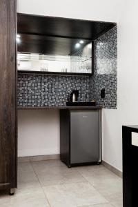 a kitchen with a sink and a counter top at Royal Lodge in Sibasa