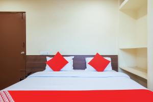 Ένα ή περισσότερα κρεβάτια σε δωμάτιο στο Hotel O Anu Grand +34 φωτογραφίες