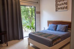Llit o llits en una habitació de Espaciosa casa: 4 suites, jardín, palapa y alberca