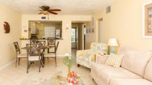 a living room with a couch and a table at 9141 Lake #102 in Englewood