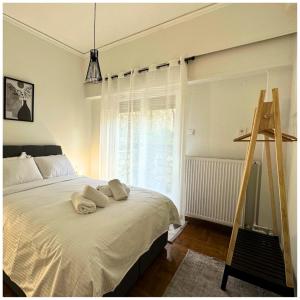 Posteľ alebo postele v izbe v ubytovaní Memories Apartments Μονοκατοικία στο Καρπενήσι