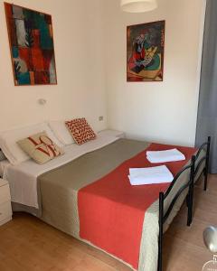Postel nebo postele na pokoji v ubytování Hotel Migani