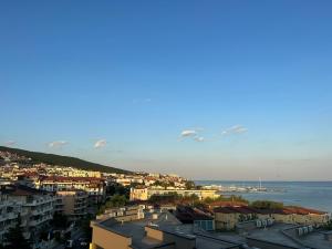 a view of a city with the ocean and buildings at Family Hotel Berlin Beach Sveti Vlas in Sveti Vlas