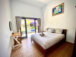 Giường trong phòng chung tại kubu pande canggu