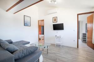 a living room with a couch and a table at Apartment Ankica in Medulin