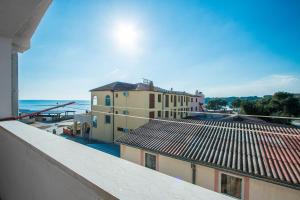 a view of a building and the ocean from a balcony at Apartment Ankica in Medulin