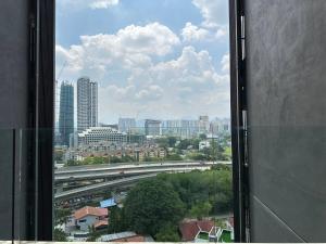 a view of a city from a window in a building at Luxury Condo Jalan Tun Razak in Kuala Lumpur
