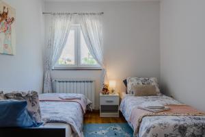 Postel nebo postele na pokoji v ubytování Apartment Olea