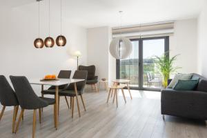 a living room with a table and chairs at Sueño Playa in Benajarafe