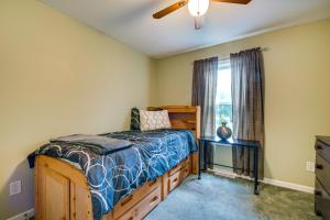 a bedroom with a bed and a window at Charming Berwick Retreat with Gas Grill and Deck! in Berwick