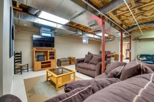 a living room with a couch and a tv at Charming Berwick Retreat with Gas Grill and Deck! in Berwick