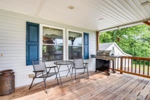 a porch with a table and chairs and a grill at Charming Berwick Retreat with Gas Grill and Deck! in Berwick