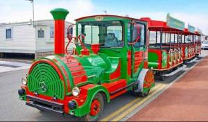 a small green and red train on the street at Rhyl, Wales, CHESTNUT GARDENS Cost road Rhyl in Meliden