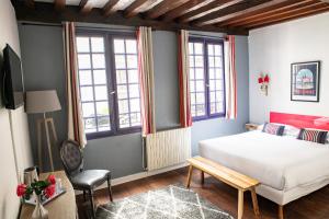 Postel nebo postele na pokoji v ubytování Hotel Le Port Neuf