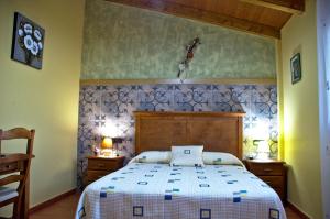 a bedroom with a large bed in a room at casa oliva la bodegueta in Abiego +23 photos