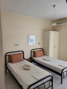 Postel nebo postele na pokoji v ubytování Polyxenis Rooms