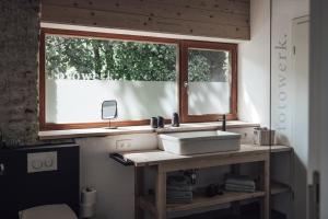 a bathroom with a sink and a window at Loft 88 in Eupen +21 photos
