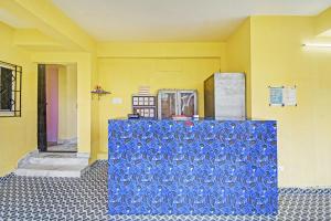 a group of blue containers sitting in a room at Hotel O Maa Residency Near Biswa Bangla in Thākurdwari