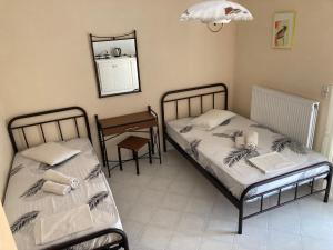 Postel nebo postele na pokoji v ubytování Polyxenis Rooms