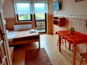 Łóżko lub łóżka w pokoju w obiekcie Dom Wypoczynkowy Grań
