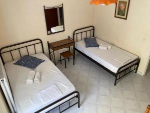 Postel nebo postele na pokoji v ubytování Polyxenis Rooms
