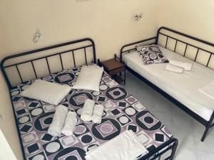 Postel nebo postele na pokoji v ubytování Polyxenis Rooms