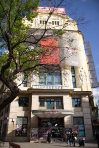 a tall building with people standing in front of it at Luxury Downtown 3 Bedroom Apartment by Synagoge with Beautiful View in Budapest