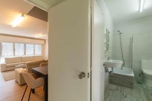 a bathroom with a sink and a toilet in a room at Villa Vacacional Toró Playa in Llanes