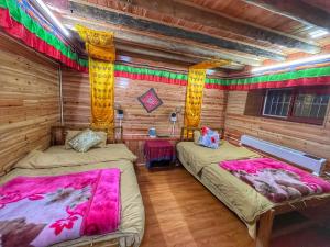 Tavern Hostel仁和客栈客房内的一张或多张床位