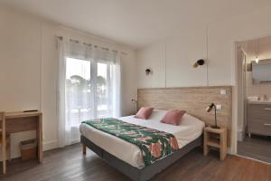 Postel nebo postele na pokoji v ubytování Hotel du Cap