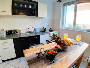 Kuchyň nebo kuchyňský kout v ubytování Amarena Apartment + 57 fotografií
