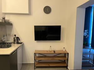 a living room with a flat screen tv on the wall at Mr. Studio in Ortakoy , North Nicosia + wifi + netflix in North Nicosia